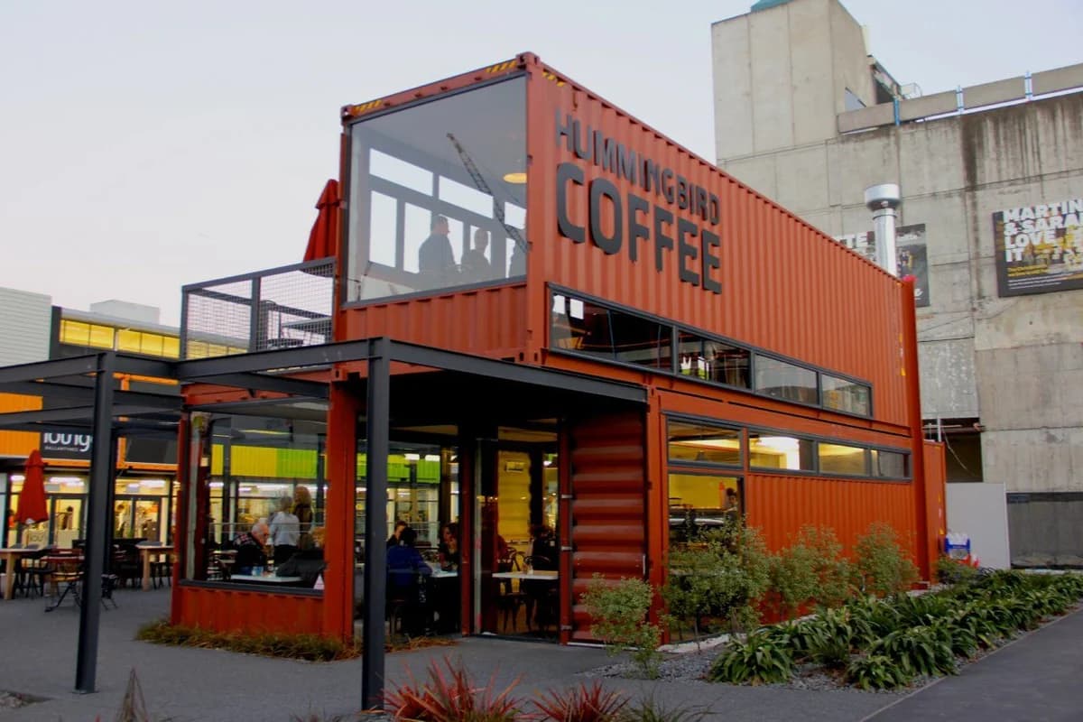 Bright orange shipping container converted into a coffee shop