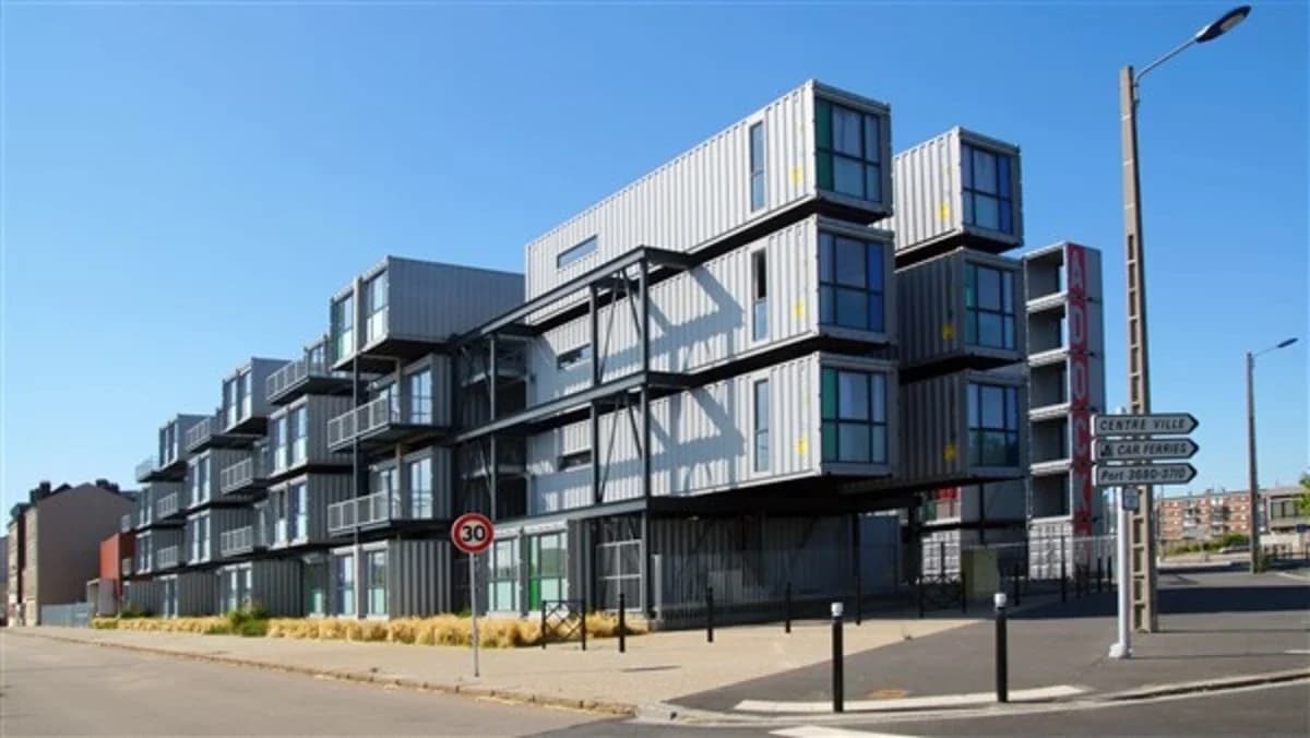 Multi-story modular building constructed from stacked shipping containers