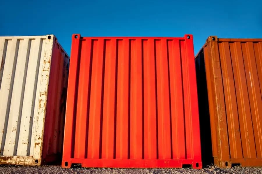 An opening being cut into the roof of a shipping container.