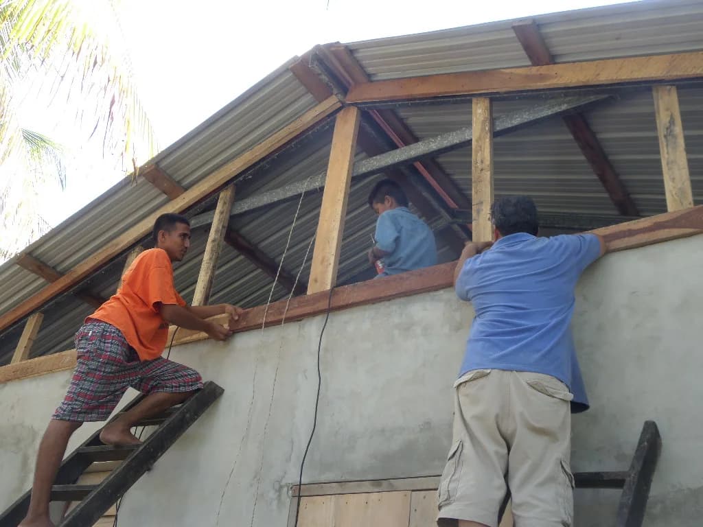 Local volunteers helping prepare the library space