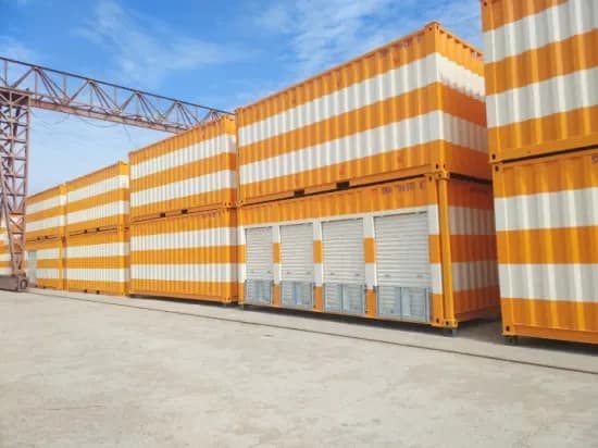 Multi-row orange and white shipping container storage facility